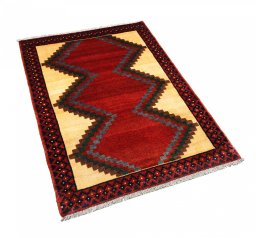 Corner detail of 2000s Persian Gabbeh rug showing border pattern and Wool pile