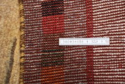 Corner detail of 2000s Persian Gabbeh rug showing border pattern and Wool pile