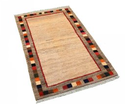 Corner detail of 2000s Persian Gabbeh rug showing border pattern and Wool pile