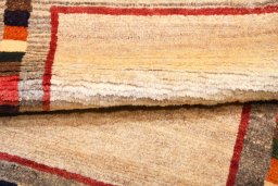 Full view of 2000s Persian Gabbeh rug from Iran / Persia, 145 × 85 cm in Beige tones
