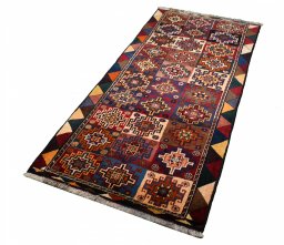 Close-up detail of 2000s Persian Gabbeh rug from Iran / Persia showing Wool weave