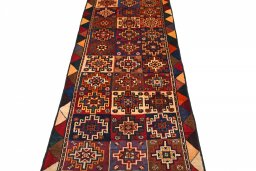 Surface texture of 2000s Persian Gabbeh rug with natural Wool and intricate pattern