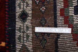 Corner detail of 2000s Persian Gabbeh rug showing border pattern and Wool pile