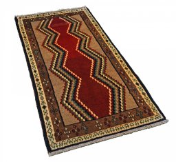 Corner detail of 2000s Persian Gabbeh rug showing border pattern and Wool pile