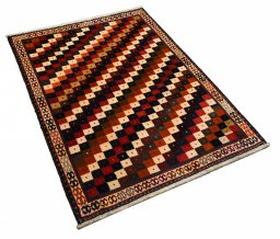 Corner detail of 2000s Persian Gabbeh rug showing border pattern and Wool pile