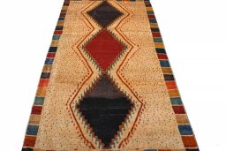 Surface texture of 2000s Persian Gabbeh rug with natural Wool and intricate pattern