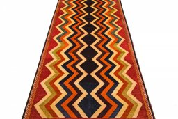 Surface texture of 2000s Persian Gabbeh rug with natural Wool and intricate pattern