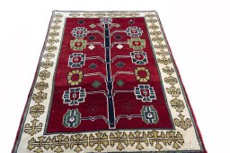 Surface texture of 2000s Persian Gabbeh rug with natural Wool and intricate pattern