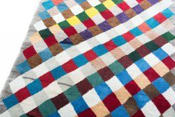 Surface texture of 2000s Persian Gabbeh rug with natural Wool and intricate pattern