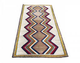 Surface texture of 2000s Persian Gabbeh rug with natural Wool and intricate pattern