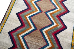 Backside of handmade 2000s Persian Gabbeh rug showing knot structure and weave density