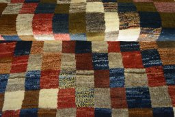 Full view of 2000s Persian Gabbeh rug from Iran / Persia, 196 × 103 cm in Multi Color tones