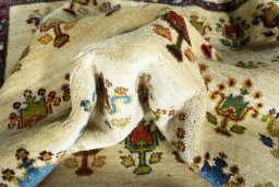 Corner detail of 2000s Persian Gabbeh rug showing border pattern and Wool pile