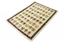 Corner detail of 2000s Persian Gabbeh rug showing border pattern and Wool pile