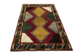 Surface texture of 2000s Persian Gabbeh rug with natural Wool and intricate pattern