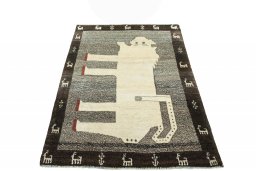 Surface texture of 2000s Persian Gabbeh rug with natural Wool and intricate pattern
