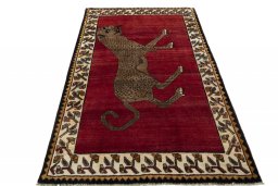 Surface texture of 2000s Persian Gabbeh rug with natural Wool and intricate pattern