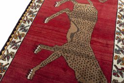 Backside of handmade 2000s Persian Gabbeh rug showing knot structure and weave density