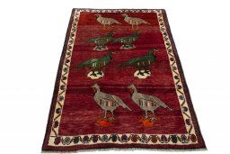 Surface texture of 2000s Persian Gabbeh rug with natural Wool and intricate pattern