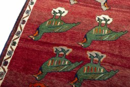 Backside of handmade 2000s Persian Gabbeh rug showing knot structure and weave density