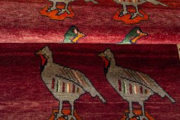Full view of 2000s Persian Gabbeh rug from Iran / Persia, 158 × 106 cm in Red tones