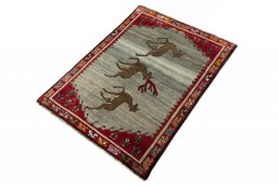 Corner detail of 2000s Persian Gabbeh rug showing border pattern and Wool pile