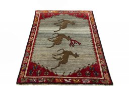 Surface texture of 2000s Persian Gabbeh rug with natural Wool and intricate pattern
