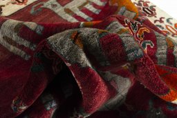 Corner detail of 2000s Persian Gabbeh rug showing border pattern and Wool pile