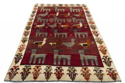 Surface texture of 2000s Persian Gabbeh rug with natural Wool and intricate pattern