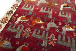 Backside of handmade 2000s Persian Gabbeh rug showing knot structure and weave density