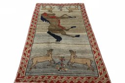 Surface texture of 2000s Persian Gabbeh rug with natural Wool and intricate pattern
