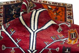 Corner detail of 2000s Persian Gabbeh rug showing border pattern and Wool pile