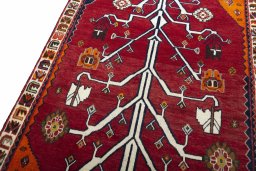 Backside of handmade 2000s Persian Gabbeh rug showing knot structure and weave density