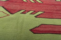Backside of handmade 2000s Persian Gabbeh rug showing knot structure and weave density