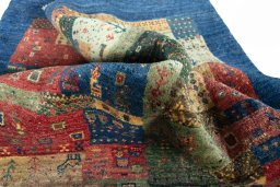 Corner detail of New Persian Gabbeh rug showing border pattern and Wool pile