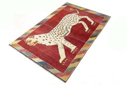 Corner detail of 2000s Persian Gabbeh rug showing border pattern and Wool pile