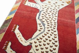 Backside of handmade 2000s Persian Gabbeh rug showing knot structure and weave density