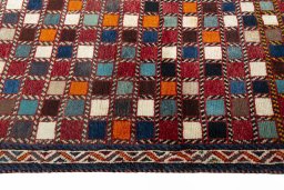 Close-up detail of 2000s Persian Gabbeh rug from Iran / Persia showing Wool weave
