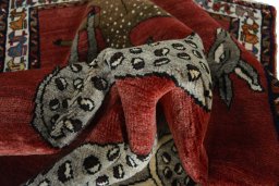 Corner detail of 2000s Persian Gabbeh rug showing border pattern and Wool pile