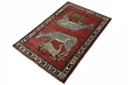 Corner detail of 2000s Persian Gabbeh rug showing border pattern and Wool pile