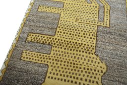Backside of handmade 2000s Persian Gabbeh rug showing knot structure and weave density