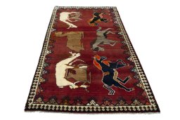 Surface texture of 2000s Persian Gabbeh rug with natural Wool and intricate pattern