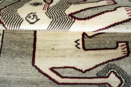 Corner detail of 2000s Persian Gabbeh rug showing border pattern and Wool pile