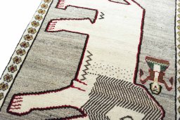 Backside of handmade 2000s Persian Gabbeh rug showing knot structure and weave density