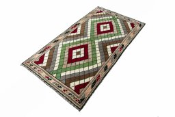 Corner detail of 2000s Persian Gabbeh rug showing border pattern and Wool pile