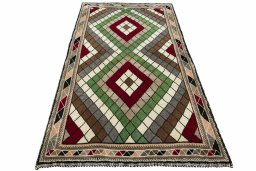 Surface texture of 2000s Persian Gabbeh rug with natural Wool and intricate pattern