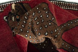 Corner detail of 2000s Persian Gabbeh rug showing border pattern and Wool pile