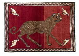 Full view of 2000s Persian Gabbeh rug from Iran / Persia, 174 × 122 cm in Red tones