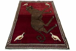 Surface texture of 2000s Persian Gabbeh rug with natural Wool and intricate pattern