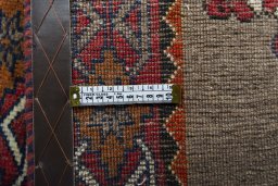 Corner detail of 2000s Persian Gabbeh rug showing border pattern and Wool pile